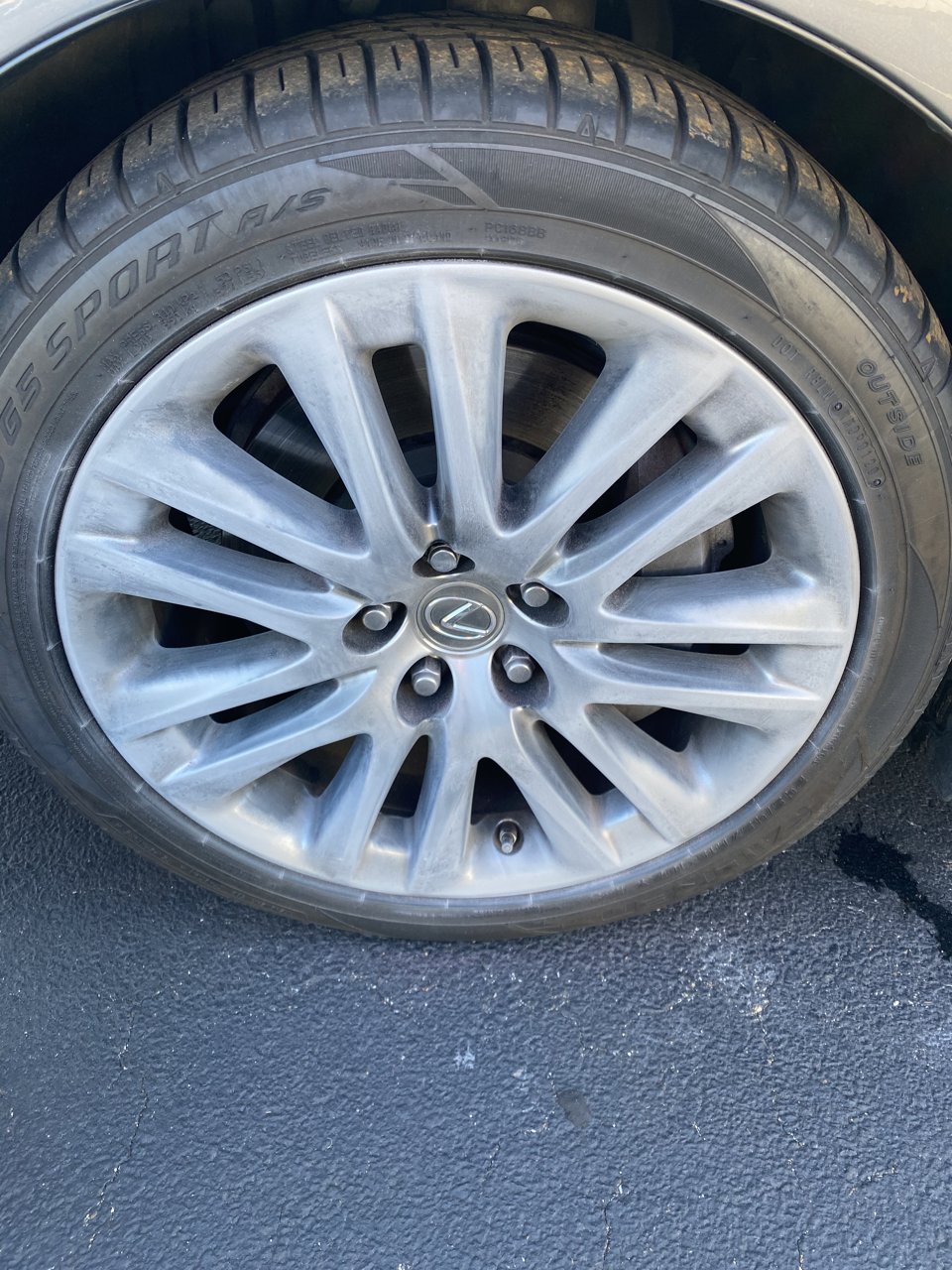 Lexus wheel during refinishing, with the surface sanded in preparation for its finish